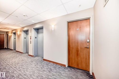 Community lobby featuring a paneled ceiling - 2004 10136 104 Street, Edmonton, AB - Indoor Photo Showing Other Room