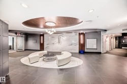 Common area with recessed lighting and a raised ceiling - 