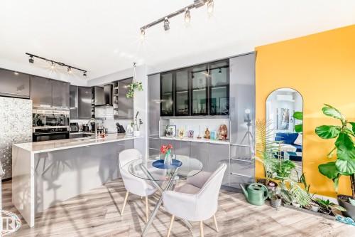 Dining room featuring rail lighting and light wood finished floors - 2004 10136 104 Street, Edmonton, AB - Indoor Photo Showing Dining Room
