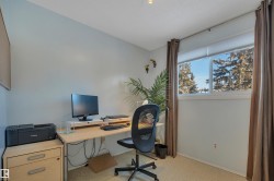 Office with baseboards and light carpet - 