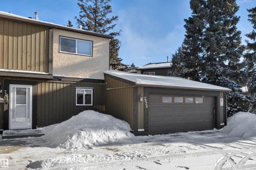 View of snowy exterior with a garage - 7075 32 Avenue, Edmonton, AB - Outdoor