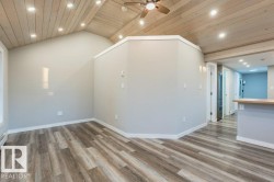 Additional living space with recessed lighting, ceiling fan, wood ceiling, and light wood-type flooring - 