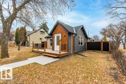 Rear view of property featuring a deck - 