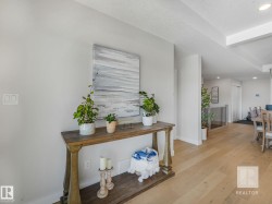 Hallway with recessed lighting and light wood-style floors - 