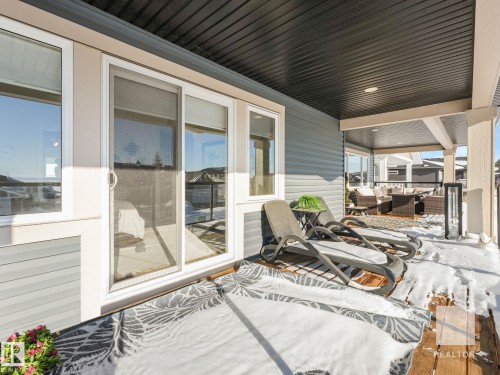 Wooden deck with a patio area - 209 55101 Ste. Anne Trail, Rural Lac Ste. Anne County, AB - Outdoor With Deck Patio Veranda With Exterior