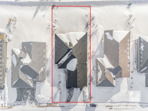 Aerial perspective of suburban area with property parcel outlined - 209 55101 Ste. Anne Trail, Rural Lac Ste. Anne County, AB - 