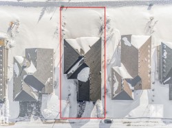 Aerial perspective of suburban area with property parcel outlined - 