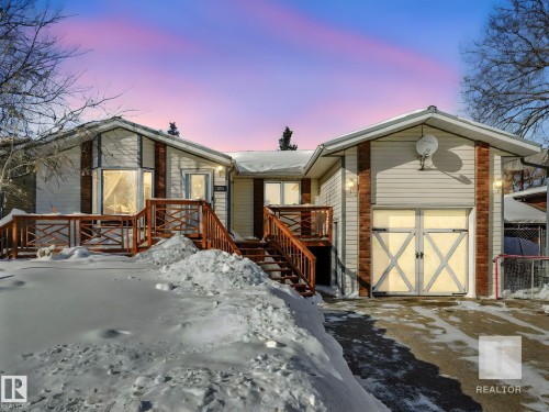 View of front of property with a shed and a wooden deck - 4504 48 Avenue, Onoway, AB - Outdoor