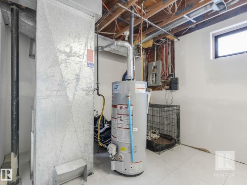 Utilities with water heater and electric panel - 4504 48 Avenue, Onoway, AB - Indoor Photo Showing Basement