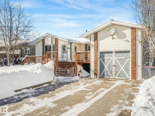 View of front of property with a deck, a garage, and driveway - 4504 48 Avenue, Onoway, AB - Outdoor