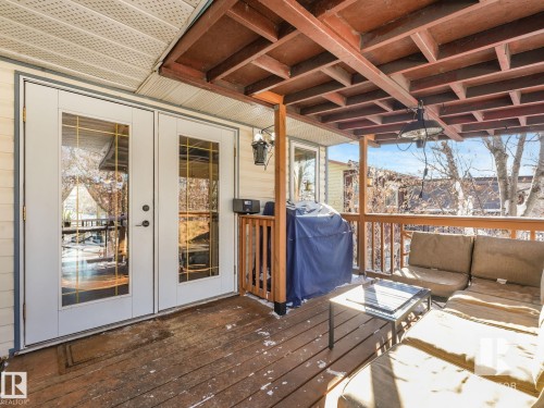 Wooden terrace with french doors, a grill, and outdoor furniture - 4504 48 Avenue, Onoway, AB - Outdoor With Deck Patio Veranda With Exterior
