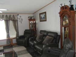 Living area featuring crown molding - 
