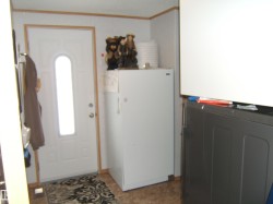 Foyer featuring ornamental molding, washer and dryer, and plenty of natural light - 