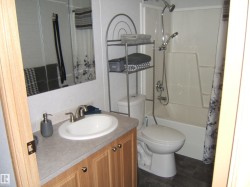 Full bathroom featuring vanity and shower / bath combination with curtain - 