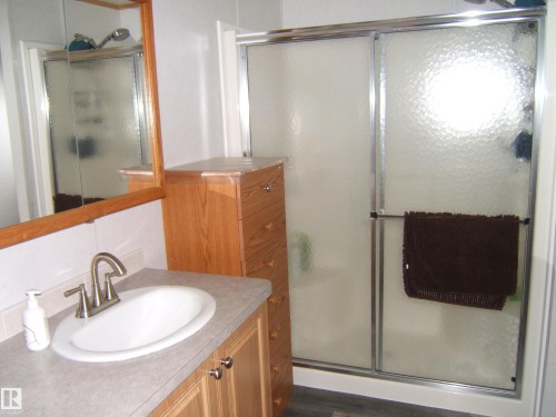 Bathroom featuring vanity and a stall shower - 125076 Twp Rd 540, Rural Two Hills County, AB - Indoor Photo Showing Bathroom