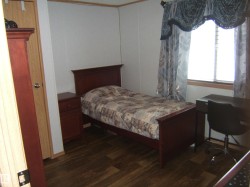 Bedroom featuring dark wood finished floors - 