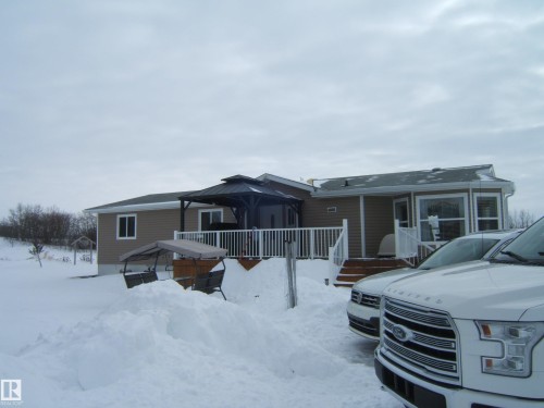 View of front facade with a gazebo and a deck - 125076 Twp Rd 540, Rural Two Hills County, AB - Outdoor With Deck Patio Veranda
