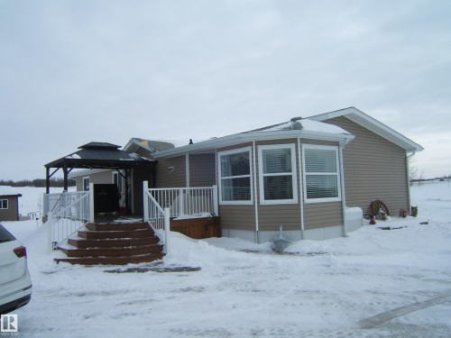 Manufactured / mobile home with a gazebo and a wooden deck - 125076 Twp Rd 540, Rural Two Hills County, AB - Outdoor With Deck Patio Veranda