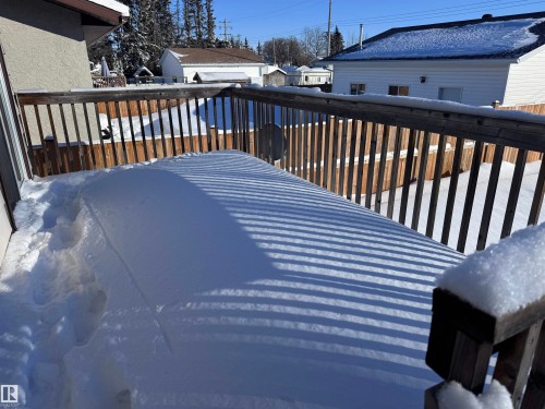 View of snow covered deck - 4919 49 Avenue, Vimy, AB - Outdoor With Exterior