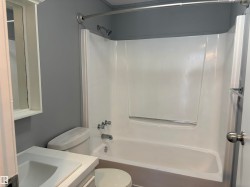 Full bathroom featuring vanity and shower / tub combination - 