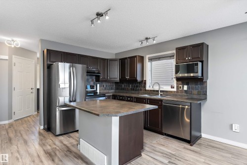 168 Keystone Crescent, Leduc, AB - Indoor Photo Showing Kitchen With Double Sink