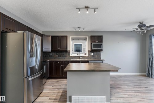 168 Keystone Crescent, Leduc, AB - Indoor Photo Showing Kitchen With Double Sink