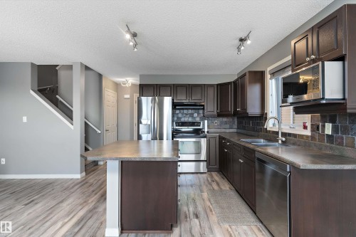 168 Keystone Crescent, Leduc, AB - Indoor Photo Showing Kitchen With Double Sink