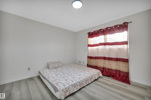 8216-8222 120 Avenue, Edmonton, AB - Indoor Photo Showing Bedroom