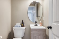Bathroom featuring vanity and toilet - 