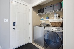 Laundry area featuring washing machine and clothes dryer - 