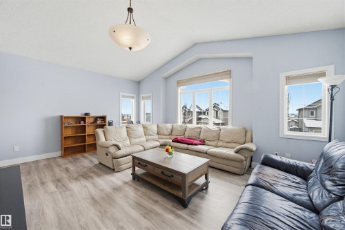 Living room with wood finished floors and baseboards - 4020 157A Avenue, Edmonton, AB - Indoor Photo Showing Living Room