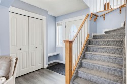 Staircase featuring wood finished floors and baseboards - 