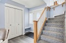 Staircase featuring wood finished floors and baseboards - 4020 157A Avenue, Edmonton, AB  - Indoor Photo Showing Other Room 
