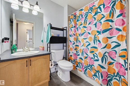Full bathroom featuring vanity and dark wood finished floors - 4020 157A Avenue, Edmonton, AB - Indoor Photo Showing Bathroom