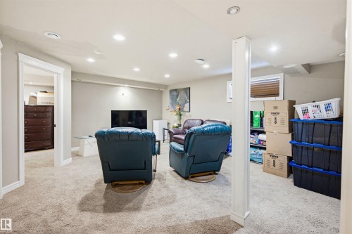 Living area with light colored carpet and recessed lighting - 4020 157A Avenue, Edmonton, AB - Indoor