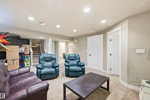 Living area with light carpet and recessed lighting - 4020 157A Avenue, Edmonton, AB - Indoor Photo Showing Living Room