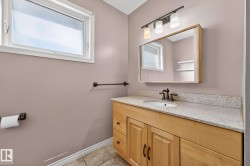 Bathroom featuring vanity and healthy amount of natural light - 