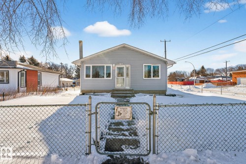 View of front of property featuring a gate, a fenced front yard, and entry steps - 4645 115 Avenue, Edmonton, AB - Outdoor
