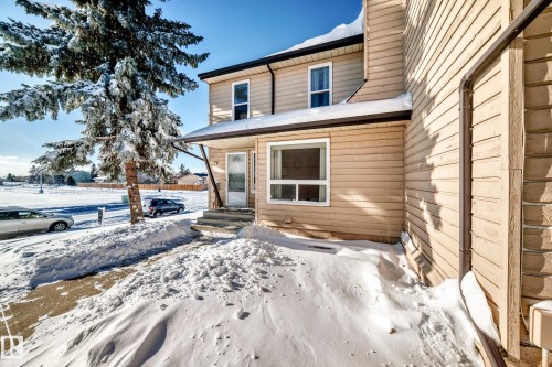 View of snow covered property entrance - 214A Warwick Road, Edmonton, AB - Outdoor