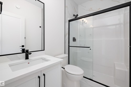 Bathroom featuring vanity and a stall shower - 6871 Knox Loop Sw, Edmonton, AB - Indoor Photo Showing Bathroom