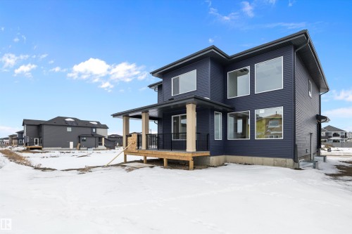 Snow covered property with a porch - 6871 Knox Loop Sw, Edmonton, AB - Outdoor