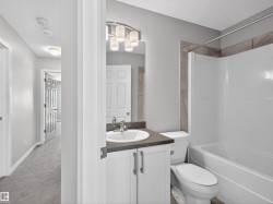 Bathroom featuring vanity, shower / bathtub combination, and toilet - 
