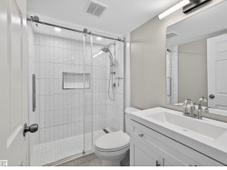 Full bathroom featuring vanity and a stall shower - 