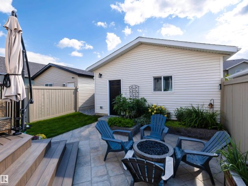 Rear view of house featuring a fire pit and a patio area - 1267 Chappelle Boulevard, Edmonton, AB - Outdoor With Deck Patio Veranda With Exterior