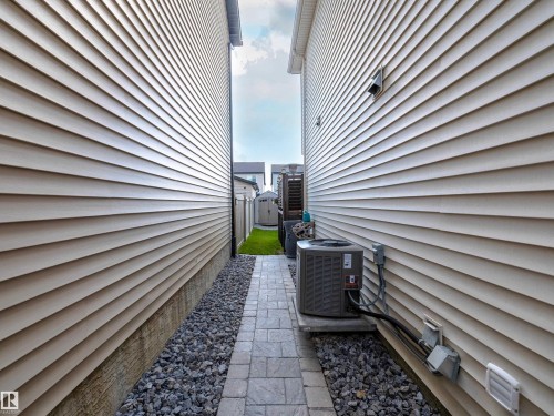 View of side of property featuring a central air condition unit - 1267 Chappelle Boulevard, Edmonton, AB - Outdoor