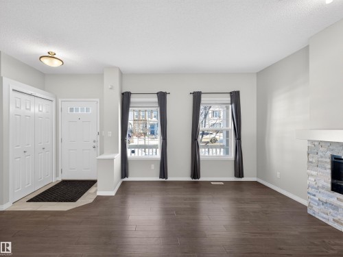 1267 Chappelle Boulevard, Edmonton, AB - Indoor Photo Showing Living Room With Fireplace