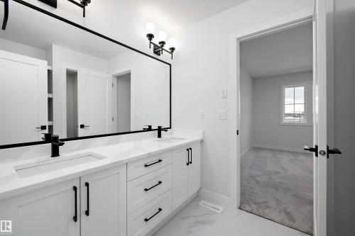 Bathroom with double vanity and light marble finish flooring - 718 Elderberry Close Nw, Edmonton, AB - Indoor Photo Showing Other Room