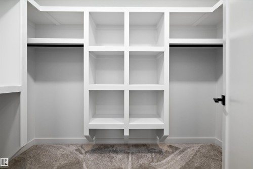 Walk in closet with carpet - 718 Elderberry Close Nw, Edmonton, AB - Indoor With Storage