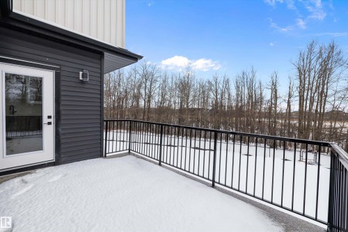 View of snow covered back of property - 718 Elderberry Close Nw, Edmonton, AB - Outdoor With Exterior