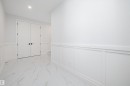 Unfurnished bedroom with a wainscoted wall, light marble finish flooring, a decorative wall, a closet, and recessed lighting - 718 Elderberry Close Nw, Edmonton, AB  - Indoor Photo Showing Other Room 